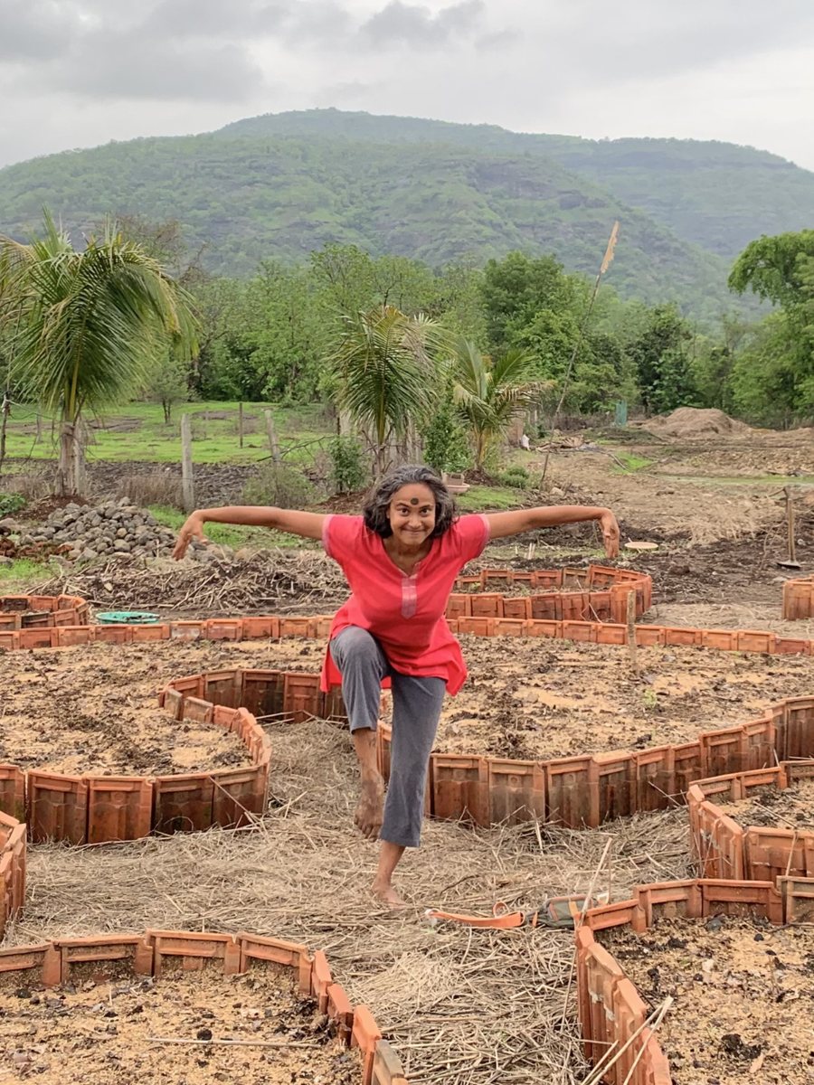 Komal on the mandala beds at the farm