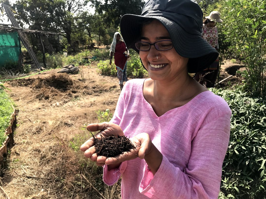 Living compost in Komal's hands